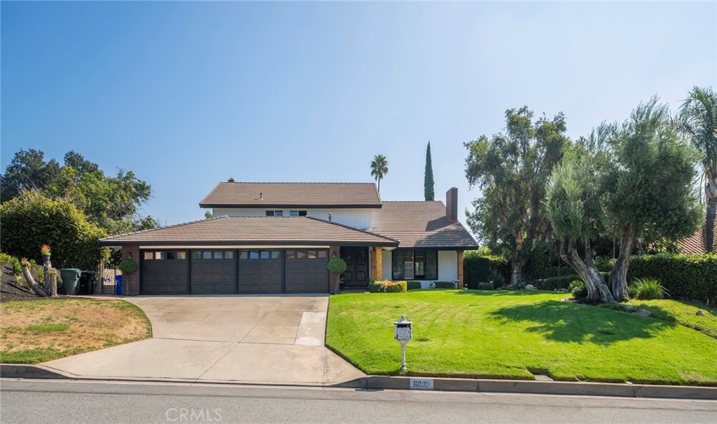 6003 Falling Tree Lane Rancho Cucamonga, CA 91737 - Photo 1 of 1 a front view of a house with a yard