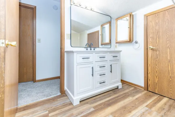 a view of a room with a ceiling fan