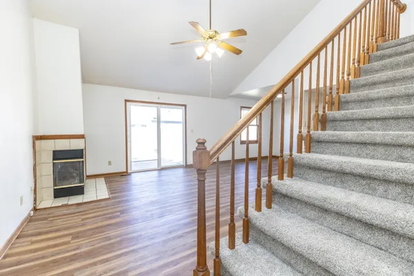 wooden floor in an empty room with a fireplace