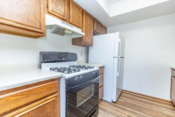a kitchen with stainless steel appliances granite countertop a stove and a sink