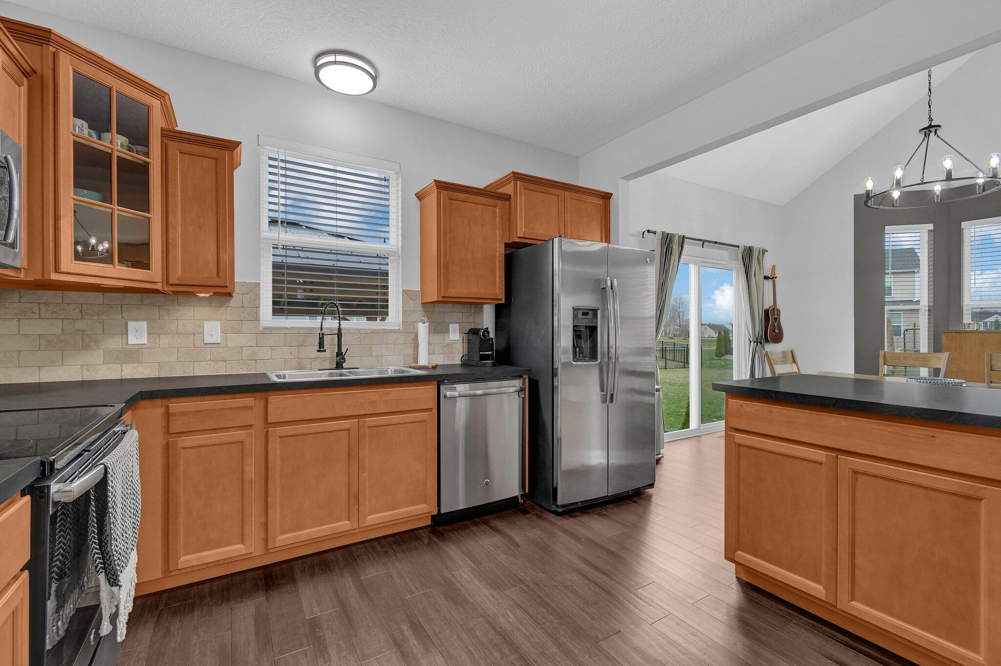 916 Rooks Circle Sunbury, OH 43074 - Photo 10 of 39 Kitchen pantry, stainless steel appliances, neutral counters, and an upgraded backsplash!