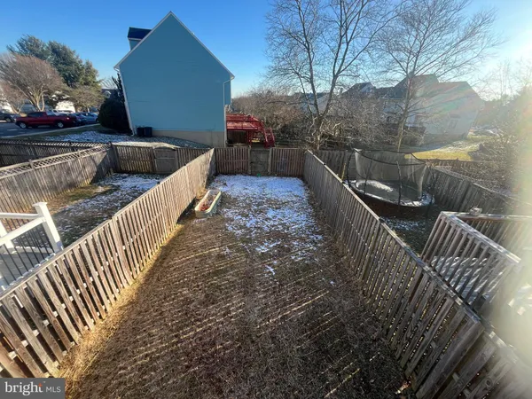 a view of deck with wooden floor and fence