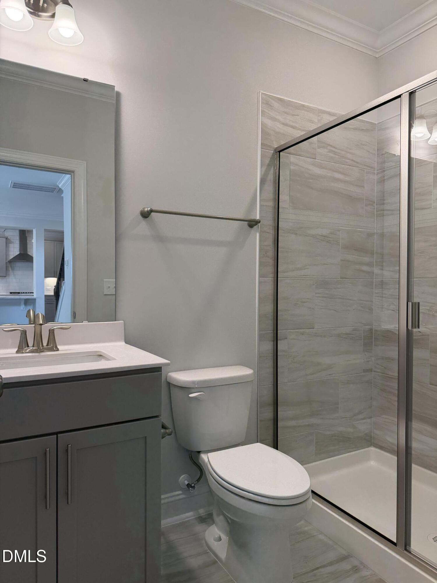 1100 Red Roses Avenue Durham, NC 27703 - Photo 12 of 51 a bathroom with a sink toilet and shower