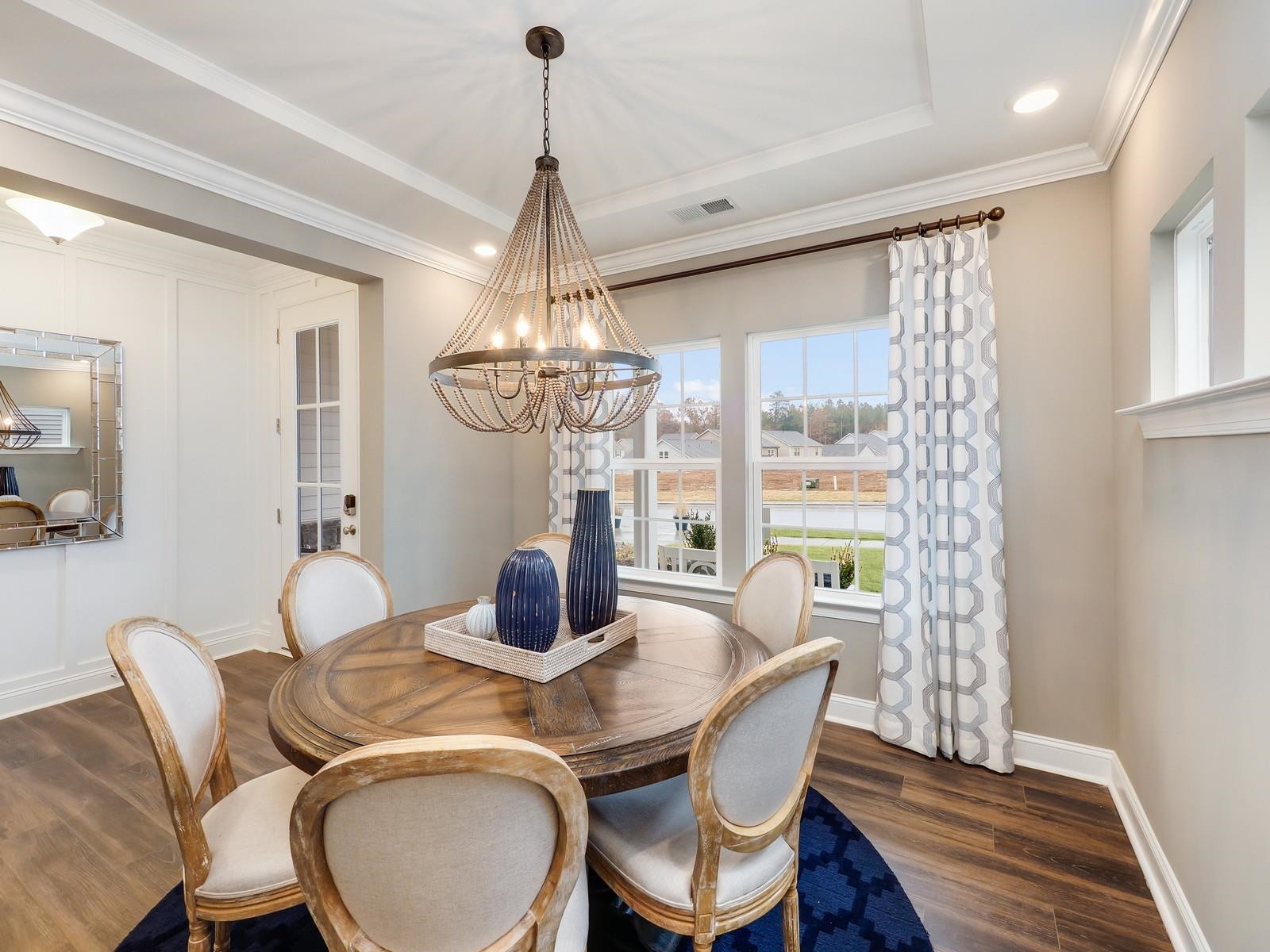 1100 Red Roses Avenue Durham, NC 27703 - Photo 28 of 51 a dining room with furniture a chandelier and wooden floor