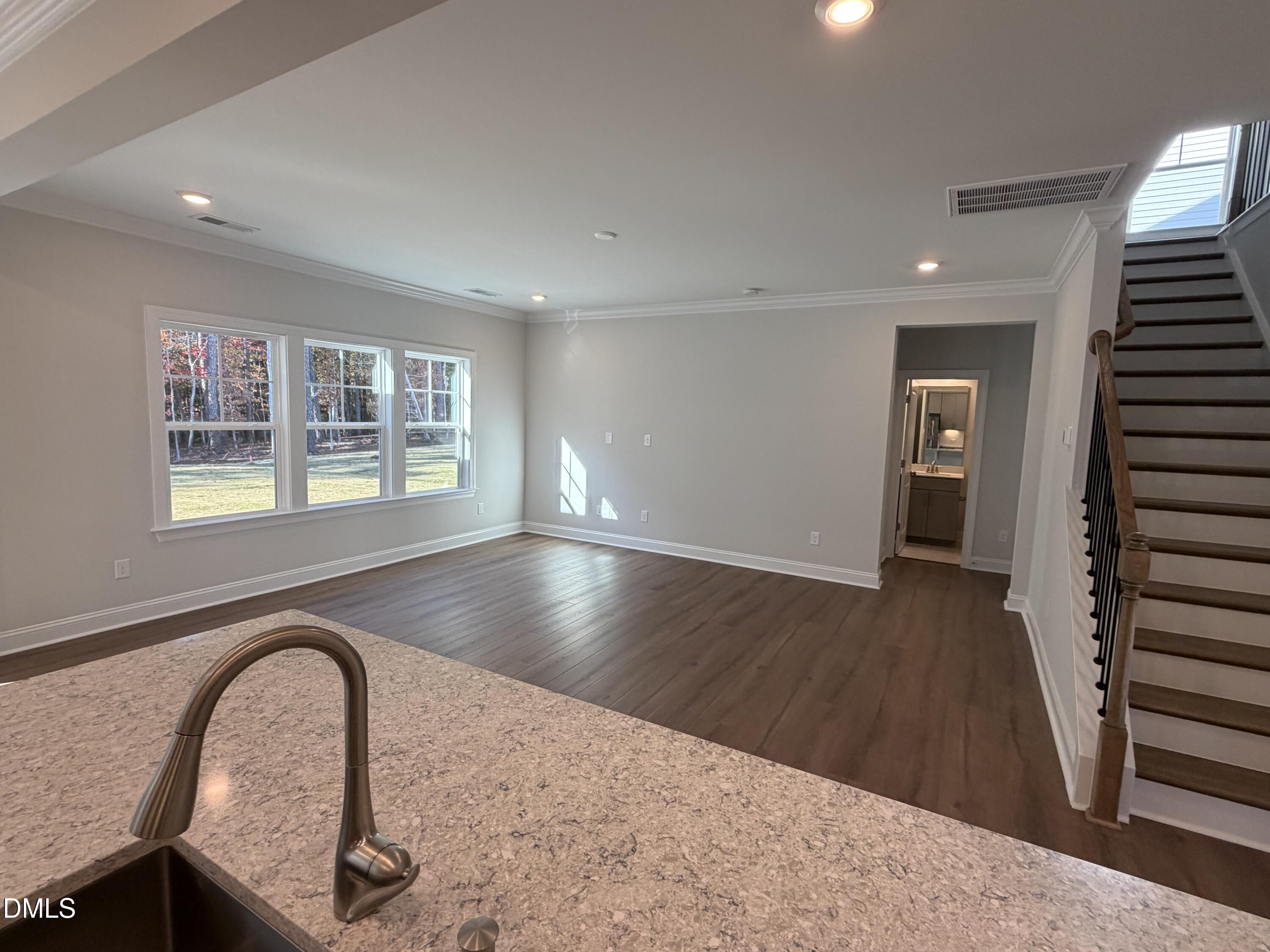 1100 Red Roses Avenue Durham, NC 27703 - Photo 46 of 51 wooden floor in an empty room with a window