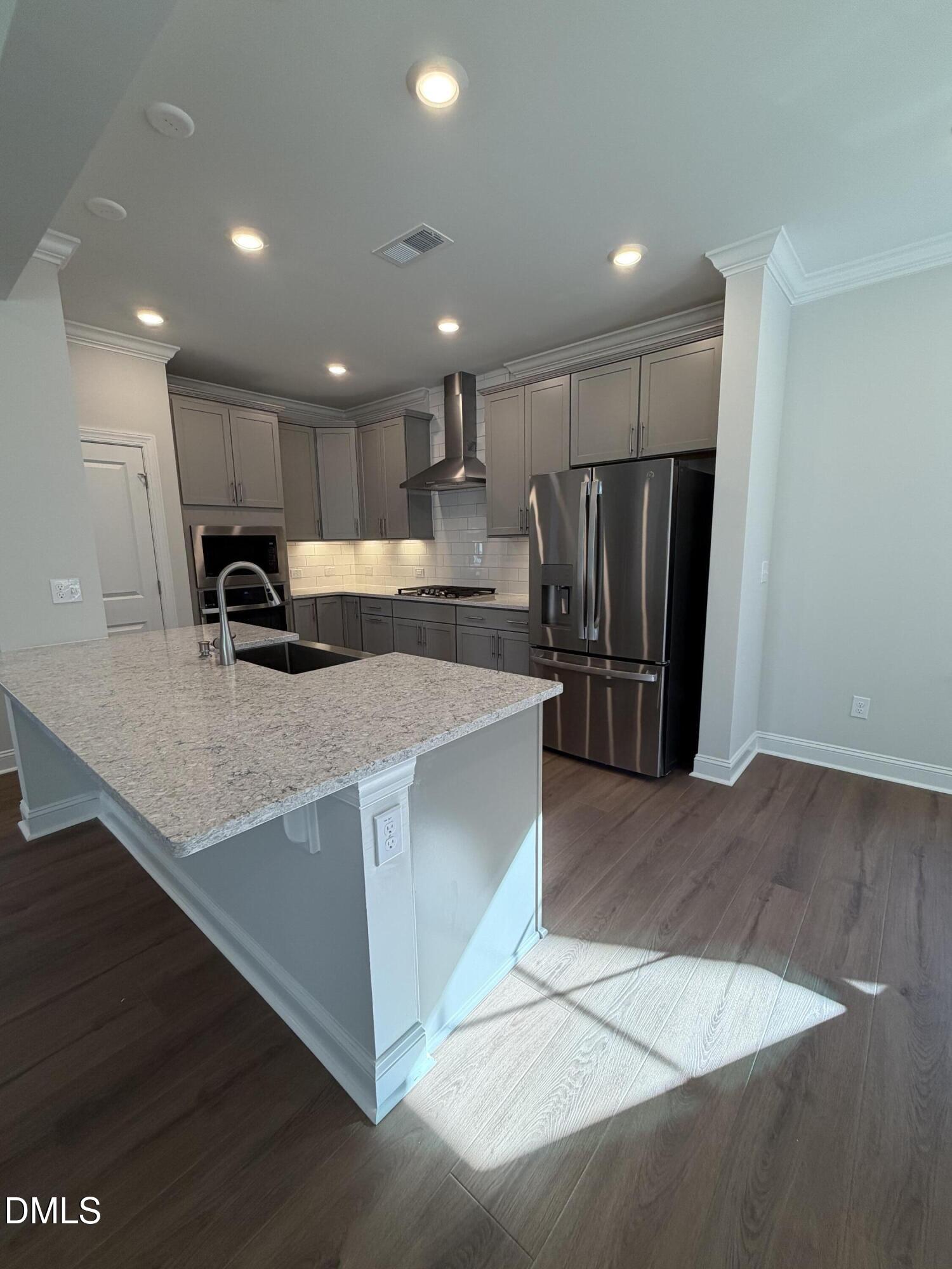 1100 Red Roses Avenue Durham, NC 27703 - Photo 7 of 51 a kitchen with stainless steel appliances granite countertop a refrigerator and a sink