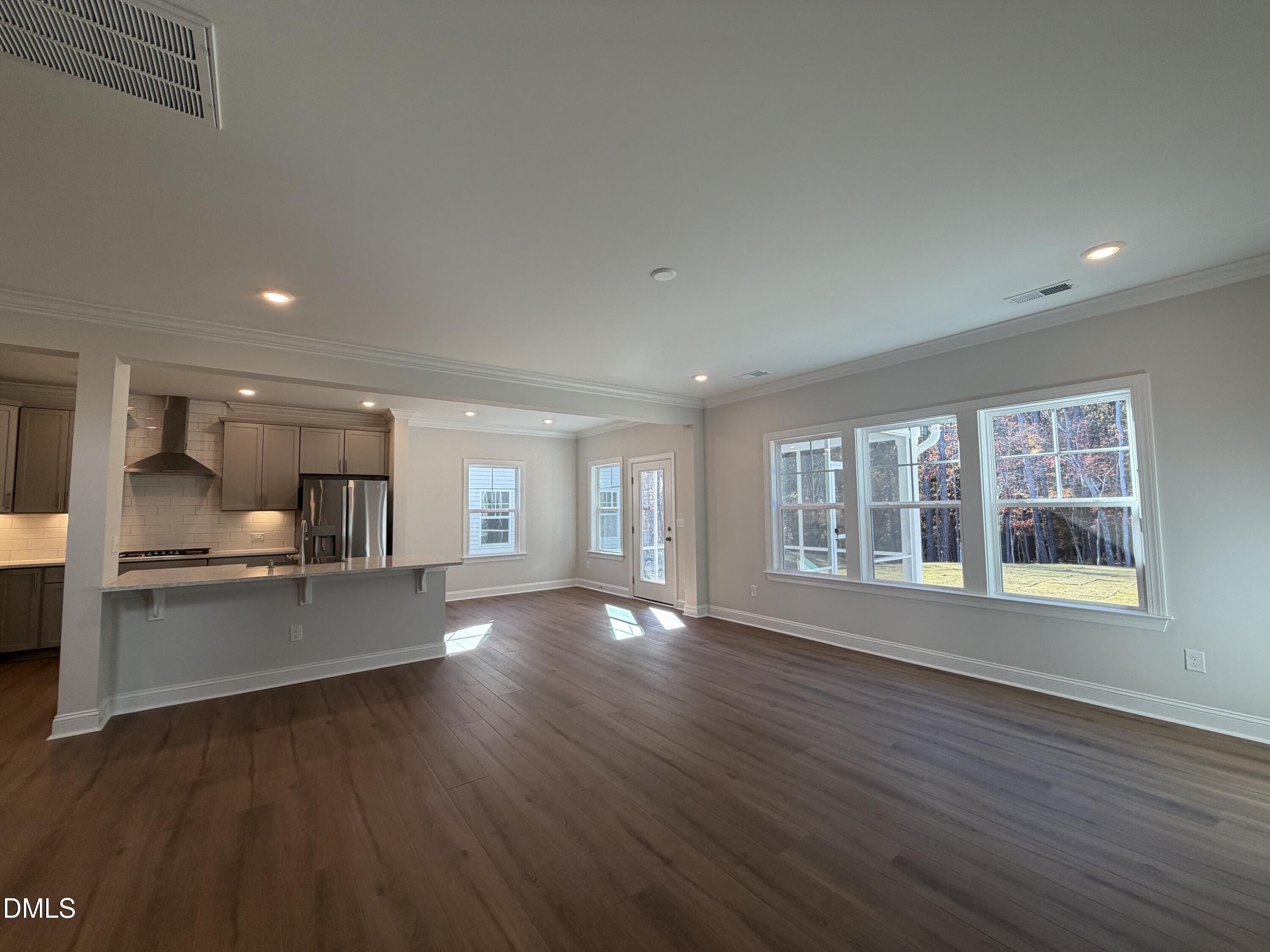 1100 Red Roses Avenue Durham, NC 27703 - Photo 10 of 51 a view of an empty room with kitchen and window