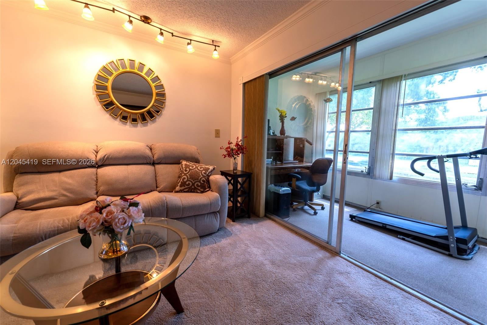 8814 West McNab Road, Unit 204 Tamarac, FL 33321 - Photo 7 of 23 Living Room and Patio