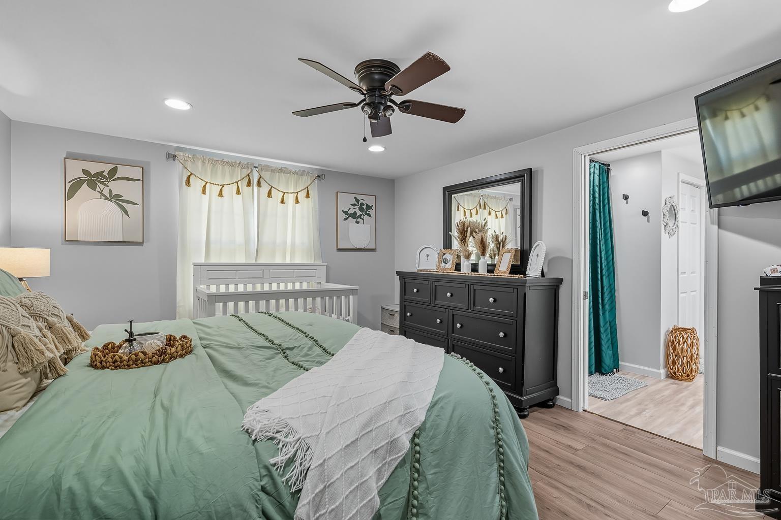 2436 Renfroe Road Pace, FL 32571 - Photo 19 of 45 a bed room with a bed and a window