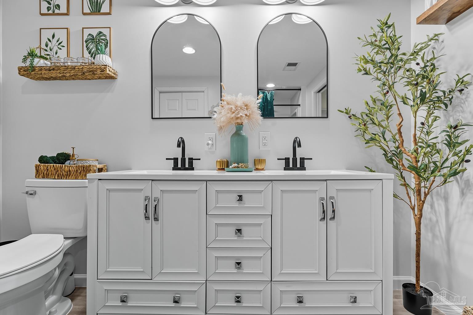 2436 Renfroe Road Pace, FL 32571 - Photo 25 of 45 a bathroom with a sink and a mirror