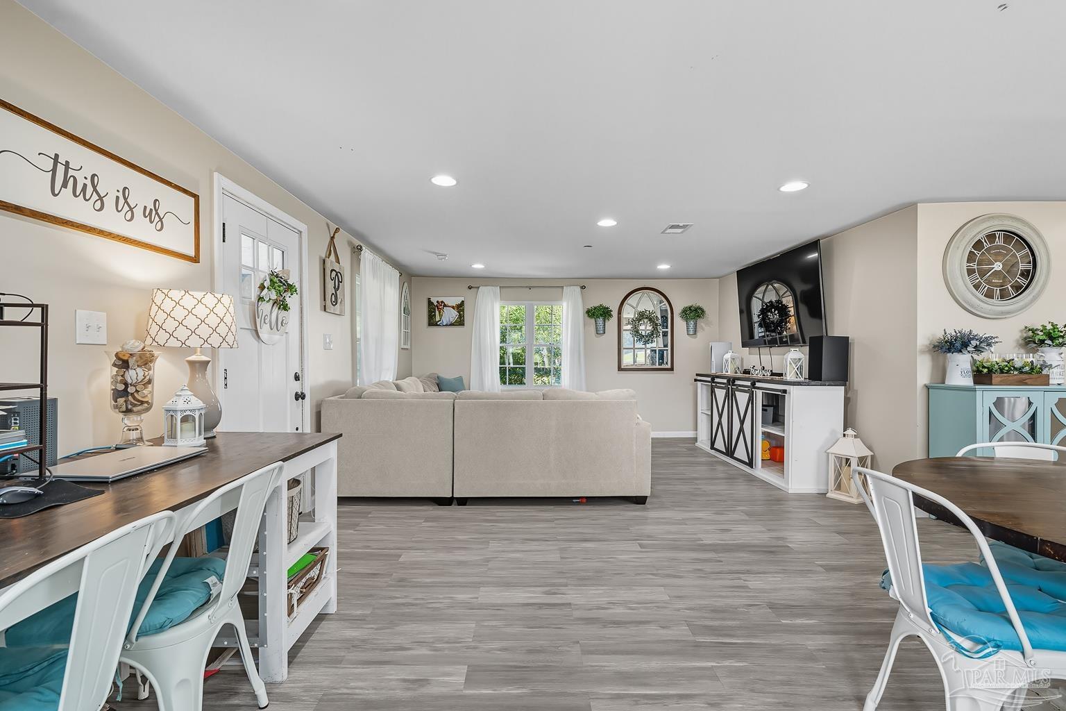 2436 Renfroe Road Pace, FL 32571 - Photo 3 of 45 a living room with furniture and a large window