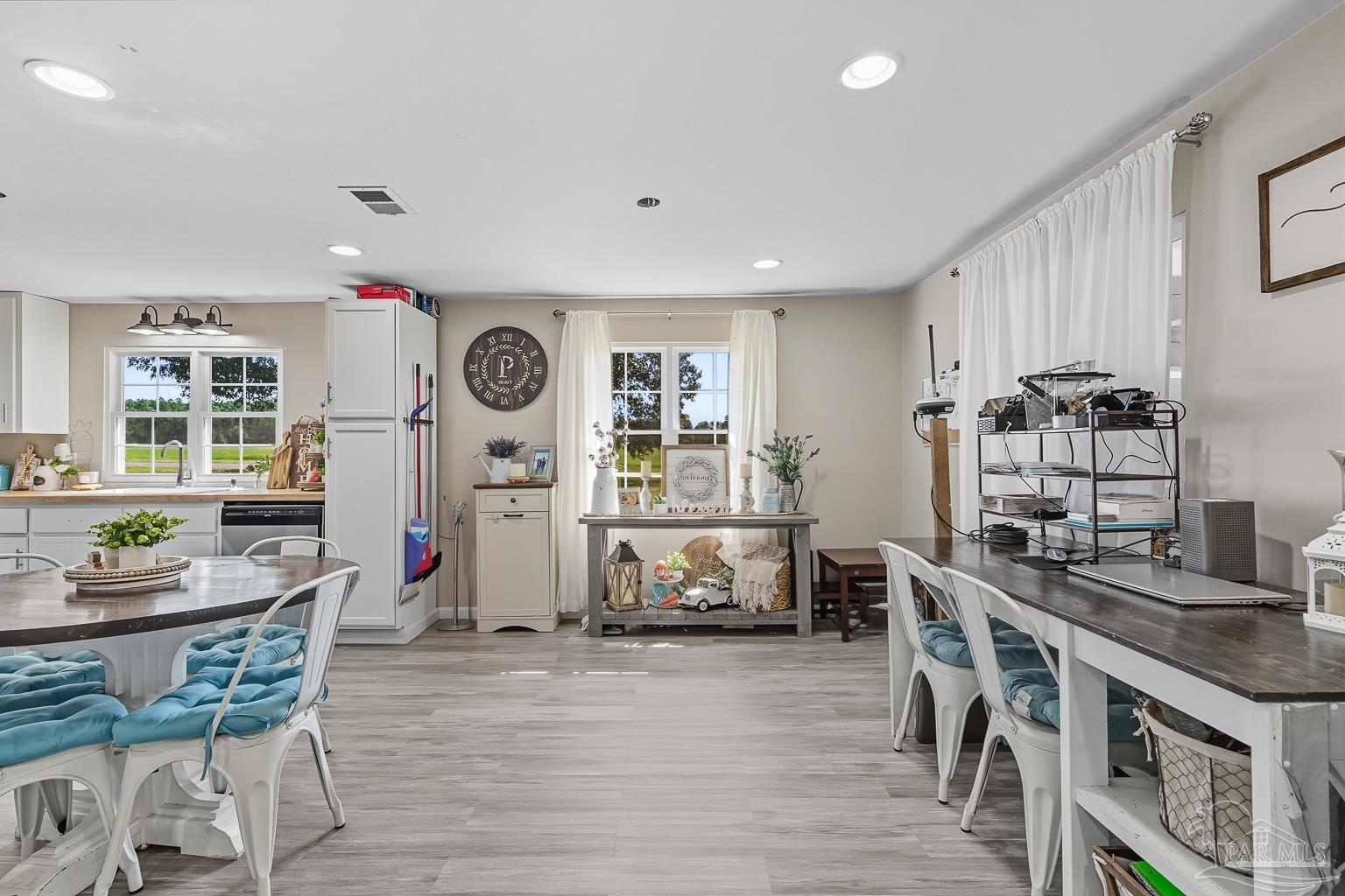 2436 Renfroe Road Pace, FL 32571 - Photo 10 of 45 a living room with furniture and wooden floor