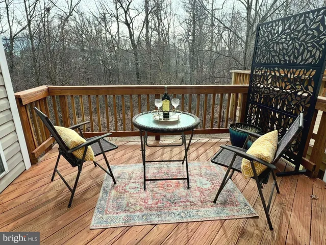 a view of a chairs and table on the deck