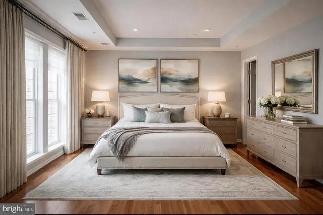 a bedroom with a large bed and a large window