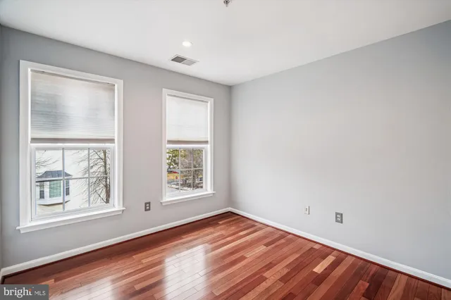 a bathroom with a bathtub shower sink vanity and toilet