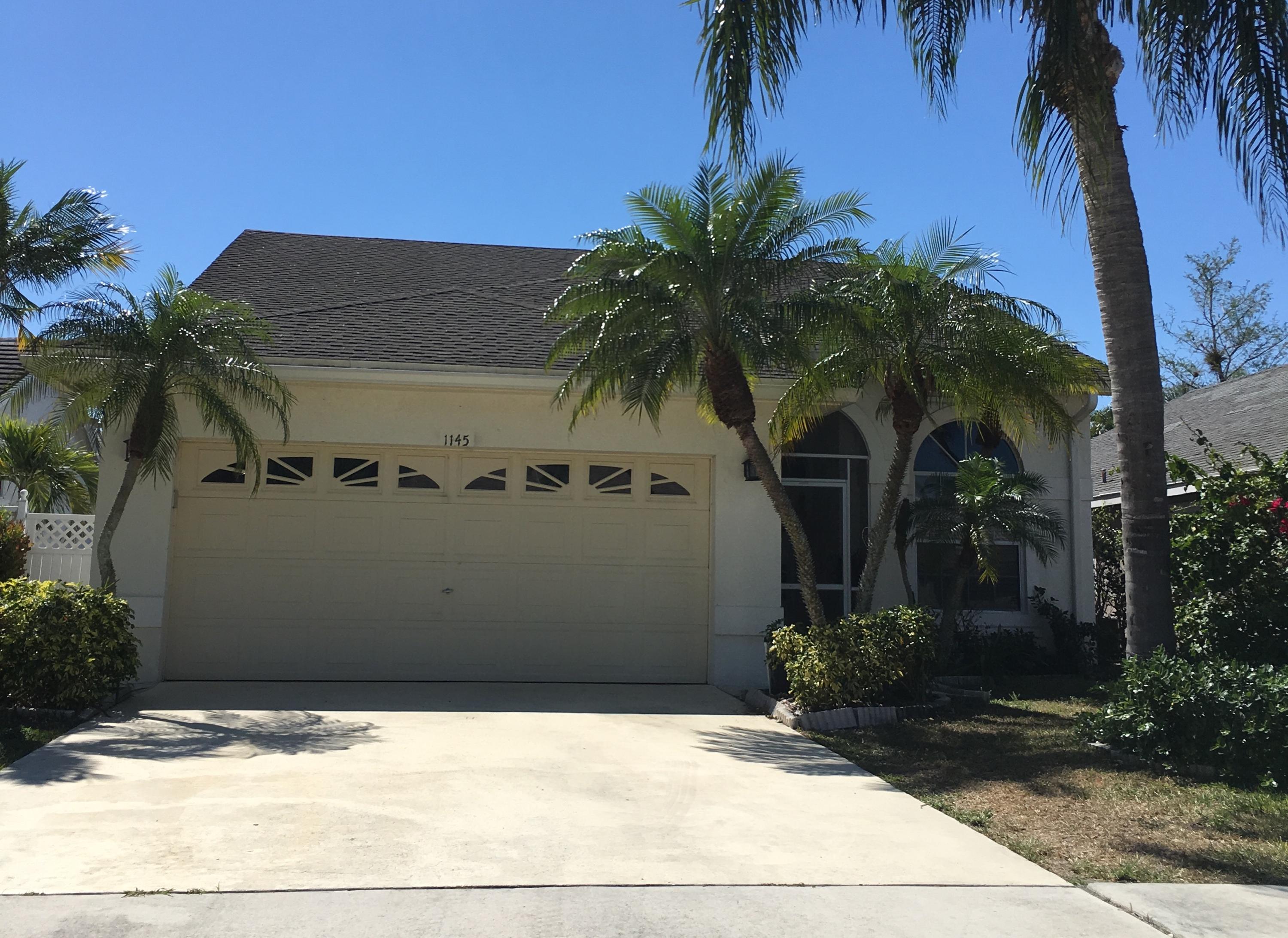 1145 Aviary Road Wellington, FL 33414 - Photo 1 of 20 Front