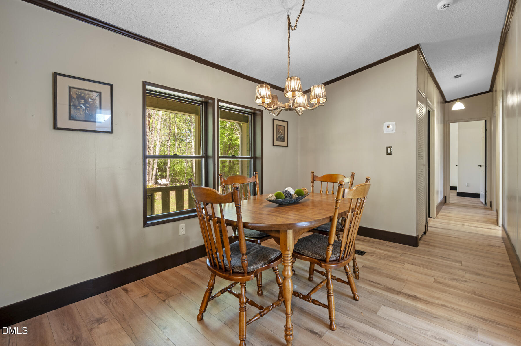 492 Little Mill Road Henderson, NC 27537 - Photo 10 of 39 a view of a dining room with furniture window and wooden floor