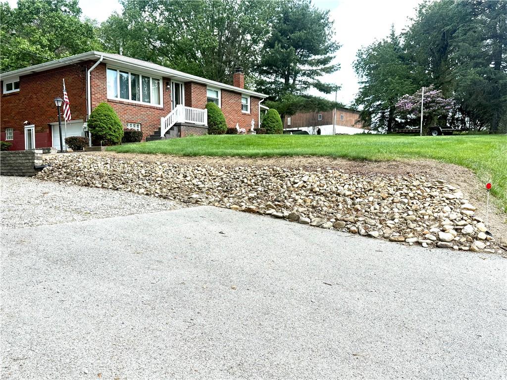 151 Huntingdon Road Wyano, PA 15695 - Photo 2 of 36 front view of a house with a yard