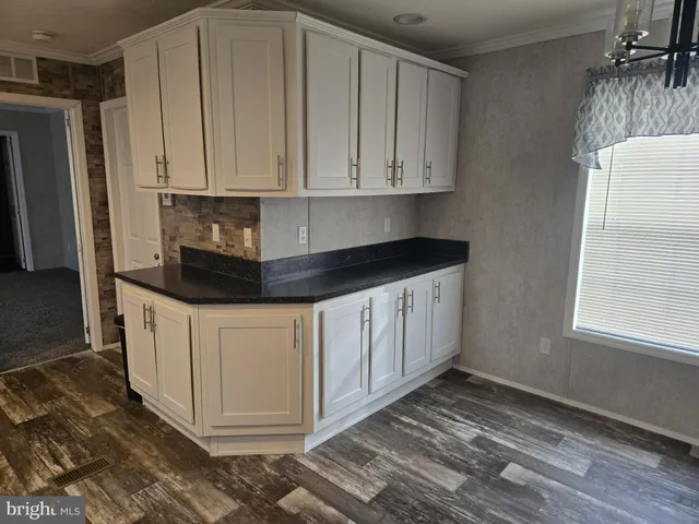 a toilet sitting in a bathroom next to a wooden wall