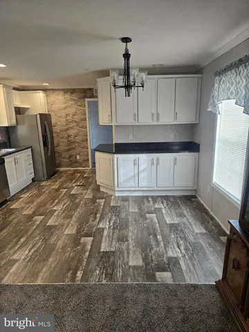 a view of a kitchen with a sink