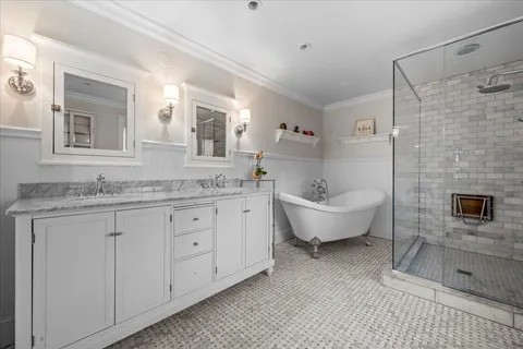 a spacious bathroom with a granite countertop sink and a mirror