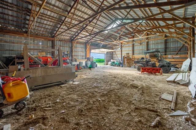 a view of a garage with parked cars