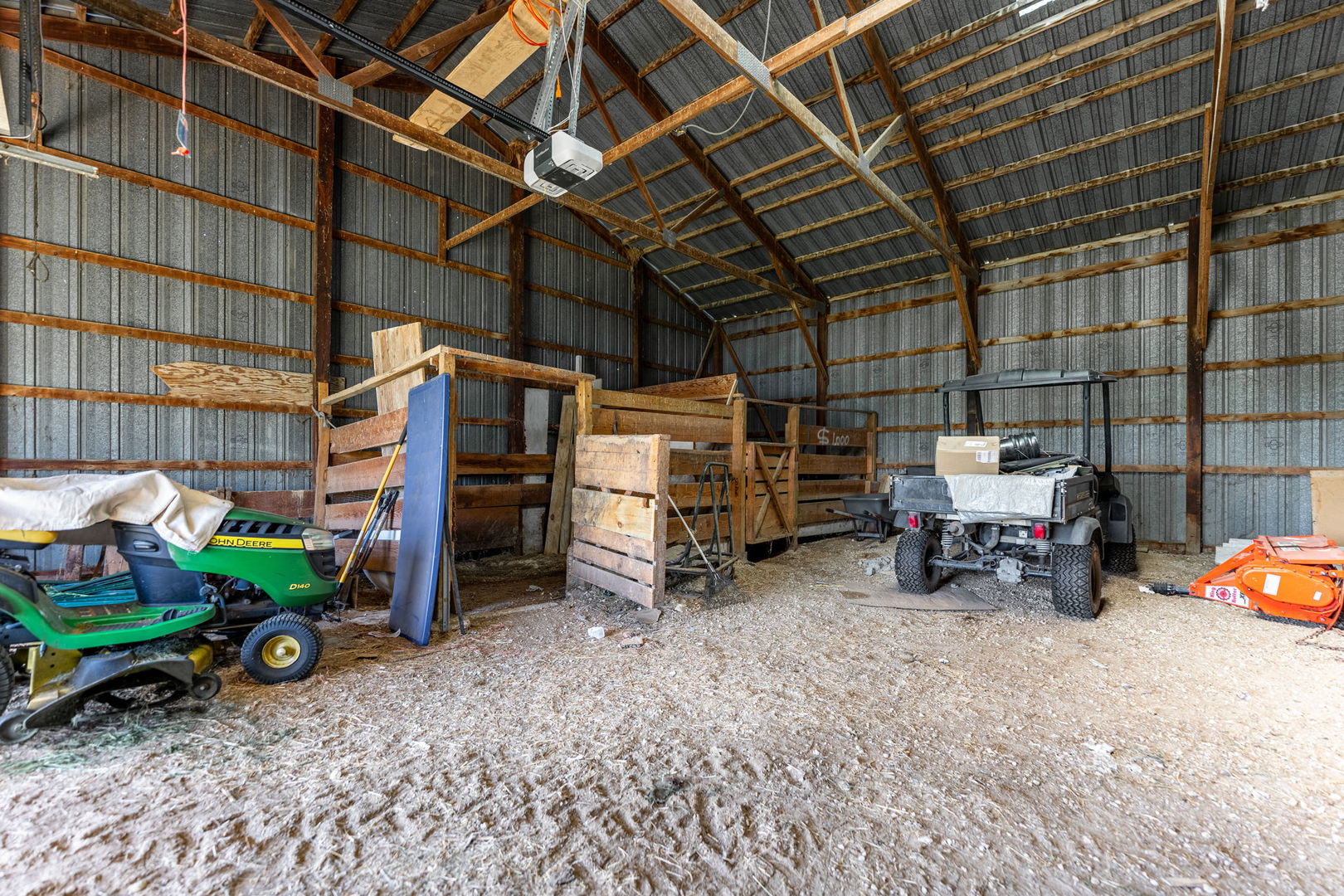 7496 Wolf Road Kingston, IL 60145 - Photo 12 of 15 a view of a garage with parked cars