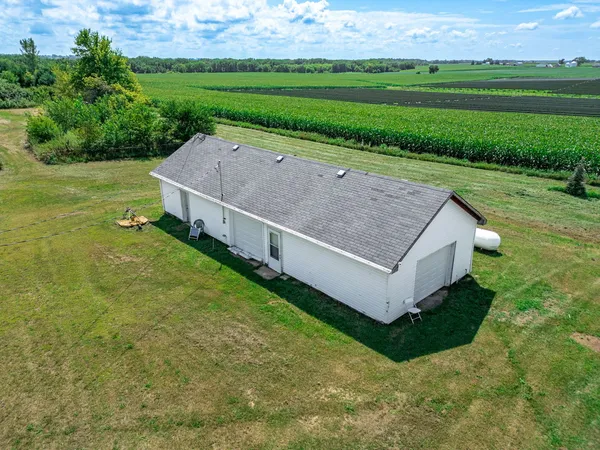 a view of an house with backyard space and garden