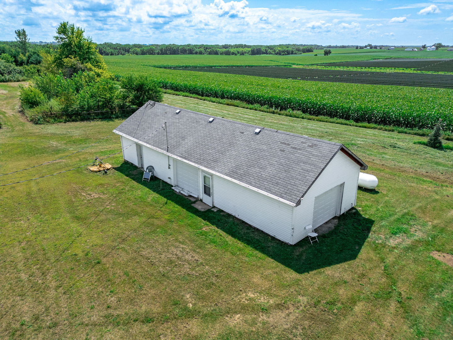 7496 Wolf Road Kingston, IL 60145 - Photo 4 of 15 a view of an house with backyard space and garden