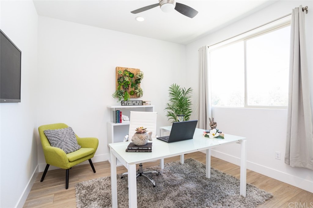 6514 Alondra Boulevard Paramount, CA 90723 - Photo 3 of 10 a living room with furniture and a potted plant