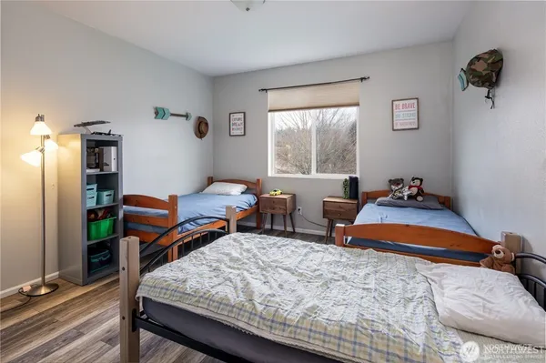 a bedroom with bed and a windows