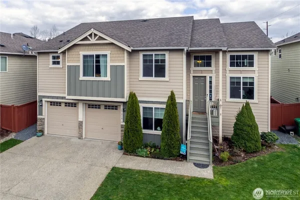 a front view of a house with a yard
