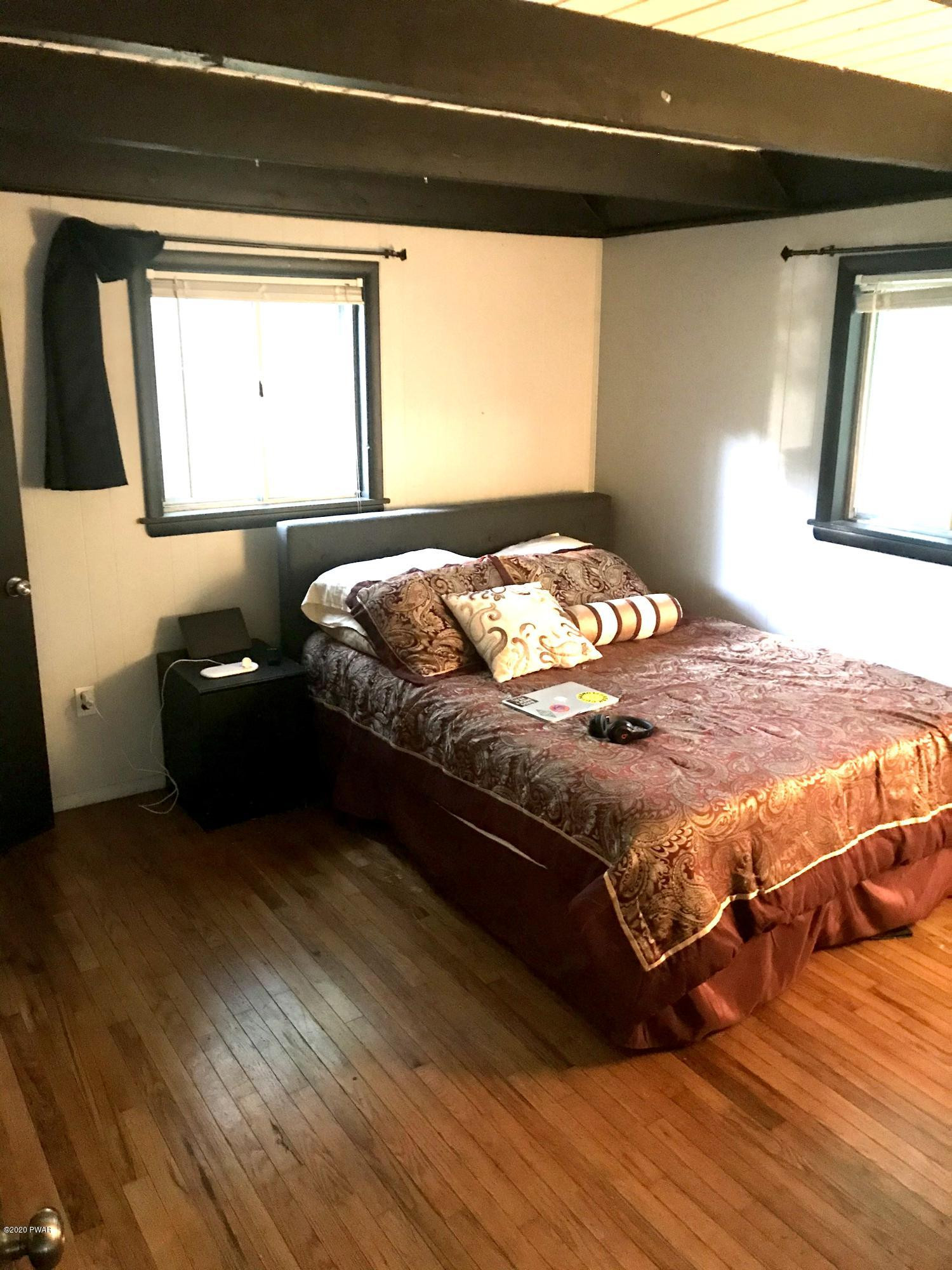 103 Hickory Road Milford, PA 18337 - Photo 13 of 22 a bedroom with a bed and a window