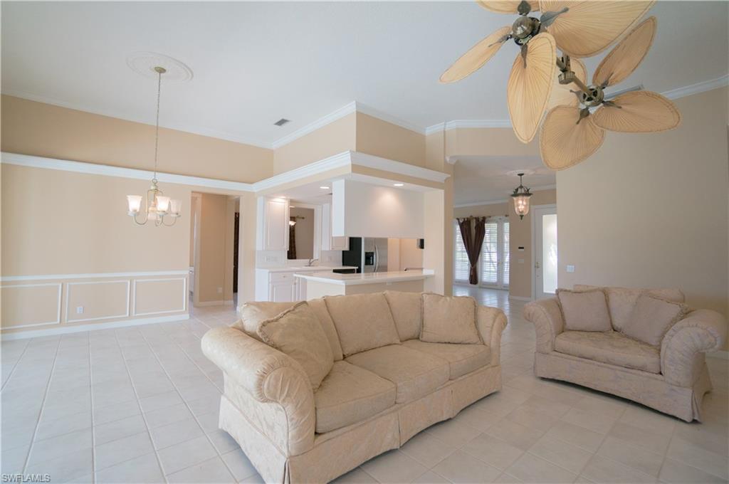 5120 Inagua Way Naples, FL 34119 - Photo 14 of 35 a living room with furniture and a ceiling fan