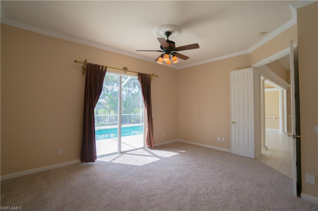 5120 Inagua Way Naples, FL 34119 - Photo 15 of 35 a view of a livingroom with a ceiling fan and window