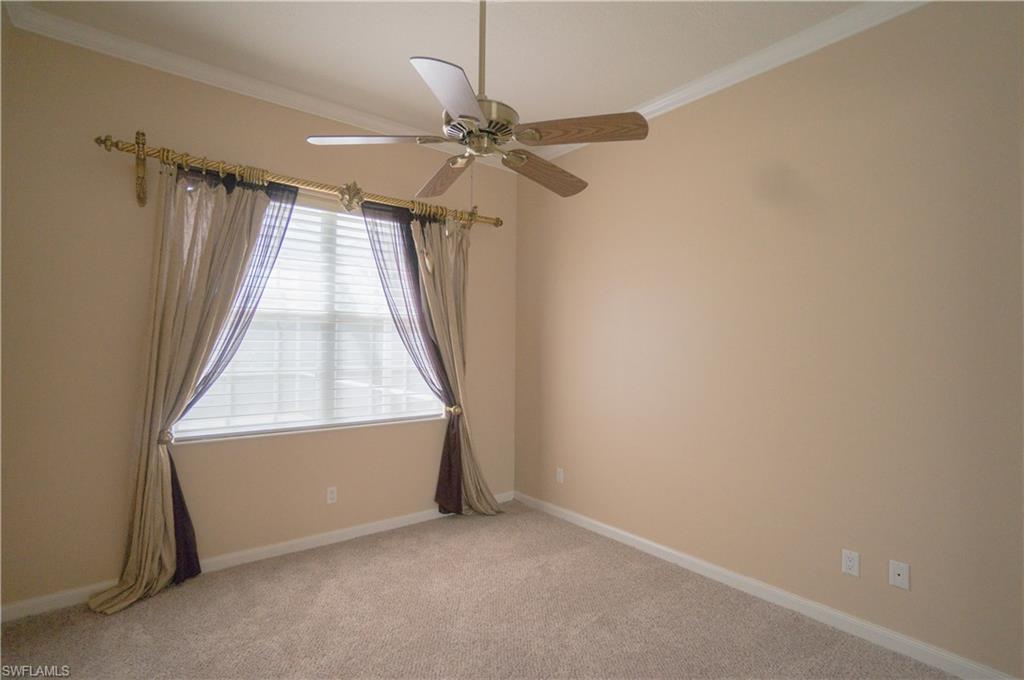 5120 Inagua Way Naples, FL 34119 - Photo 17 of 35 an empty room with windows and fan