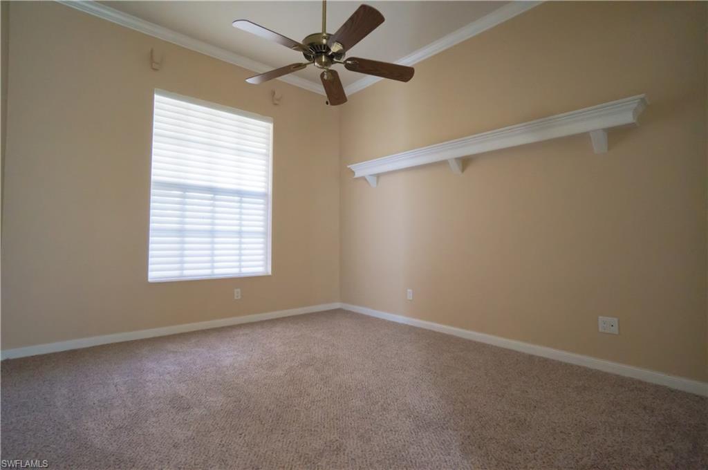 5120 Inagua Way Naples, FL 34119 - Photo 21 of 35 an empty room with a window and a fan