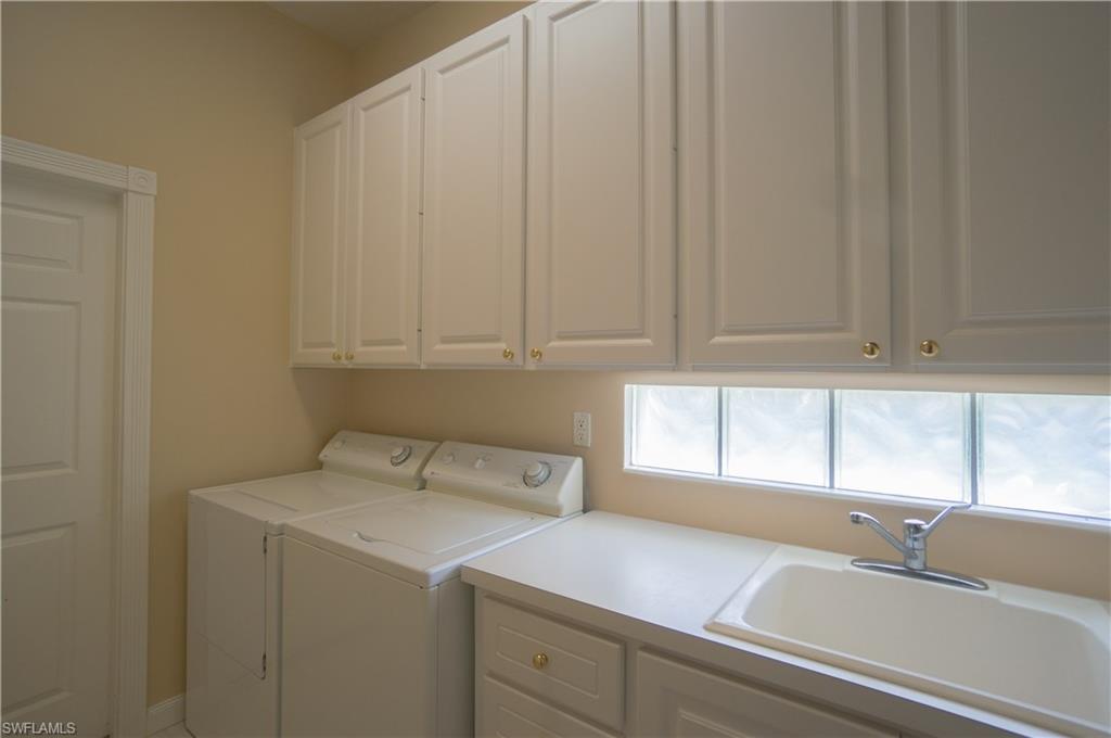 5120 Inagua Way Naples, FL 34119 - Photo 22 of 35 a kitchen with a sink cabinets and a window