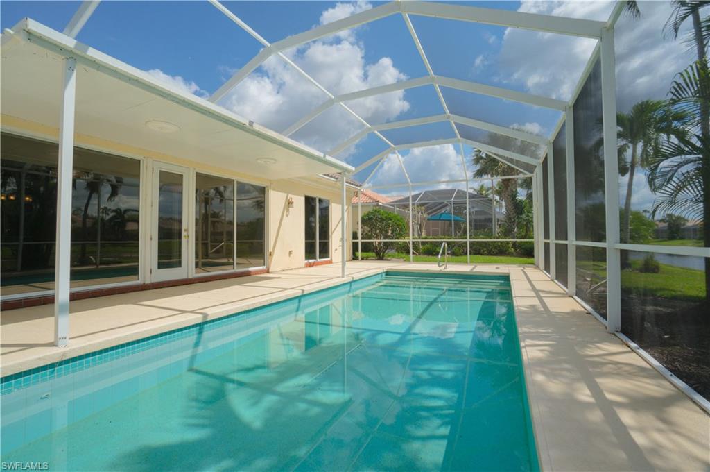 5120 Inagua Way Naples, FL 34119 - Photo 23 of 35 a view of an swimming pool with a porch