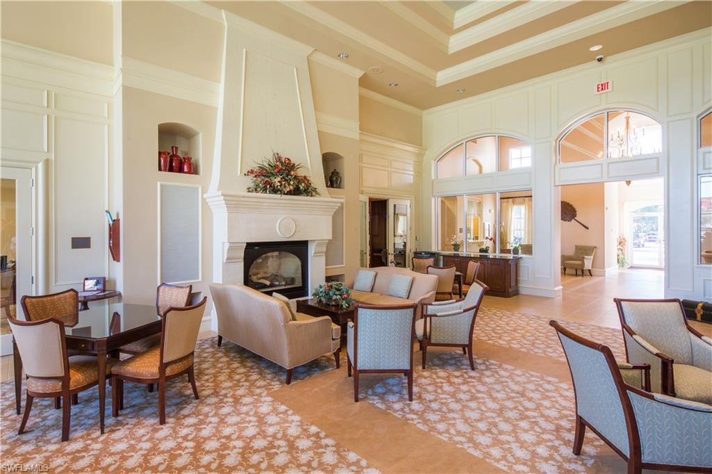 5120 Inagua Way Naples, FL 34119 - Photo 29 of 35 a living room with furniture and a fireplace