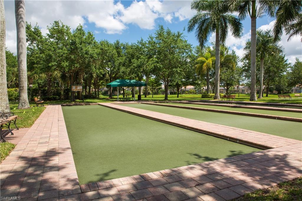 5120 Inagua Way Naples, FL 34119 - Photo 30 of 35 a view of a swimming pool with a lawn chairs and plants