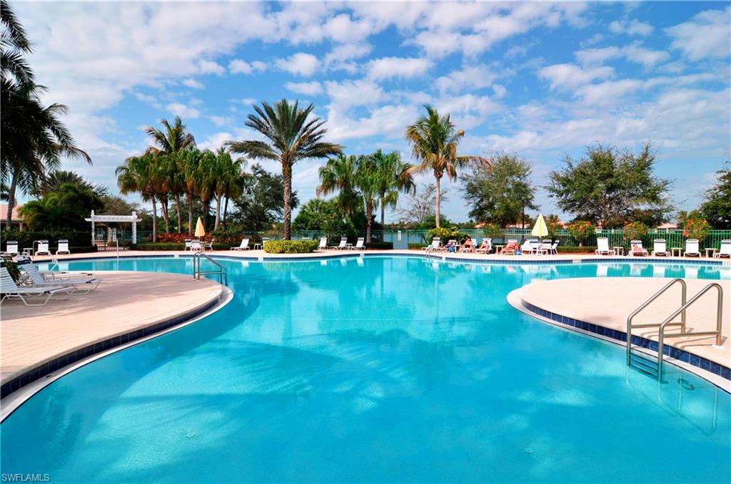 5120 Inagua Way Naples, FL 34119 - Photo 33 of 35 a view of a swimming pool with a yard