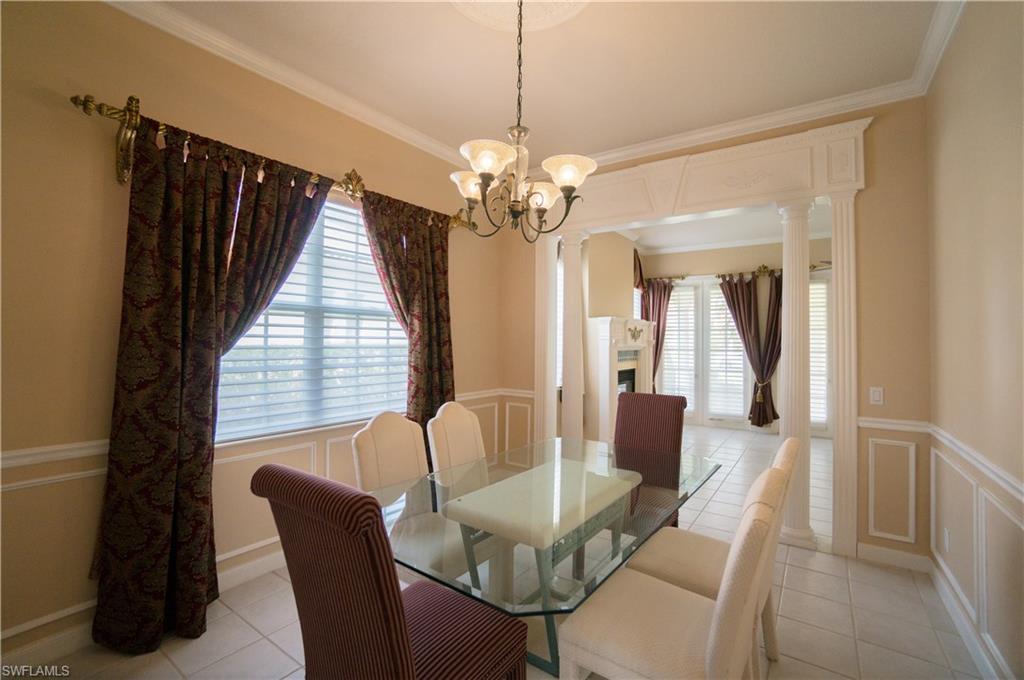 5120 Inagua Way Naples, FL 34119 - Photo 5 of 35 a view of a dining room with furniture and a chandelier