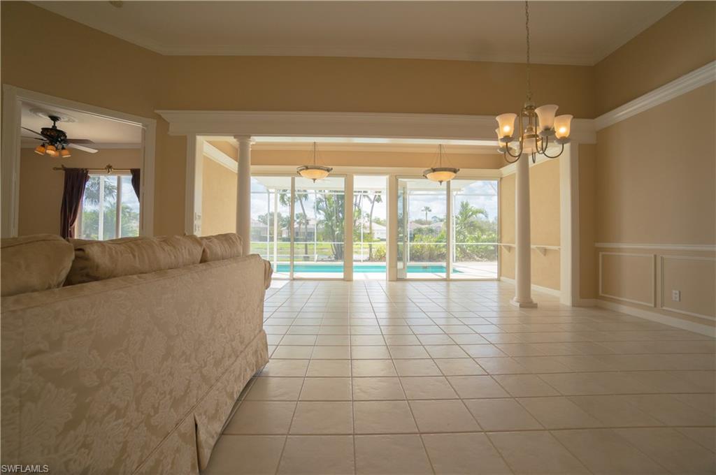 5120 Inagua Way Naples, FL 34119 - Photo 9 of 35 a view of a room with large windows