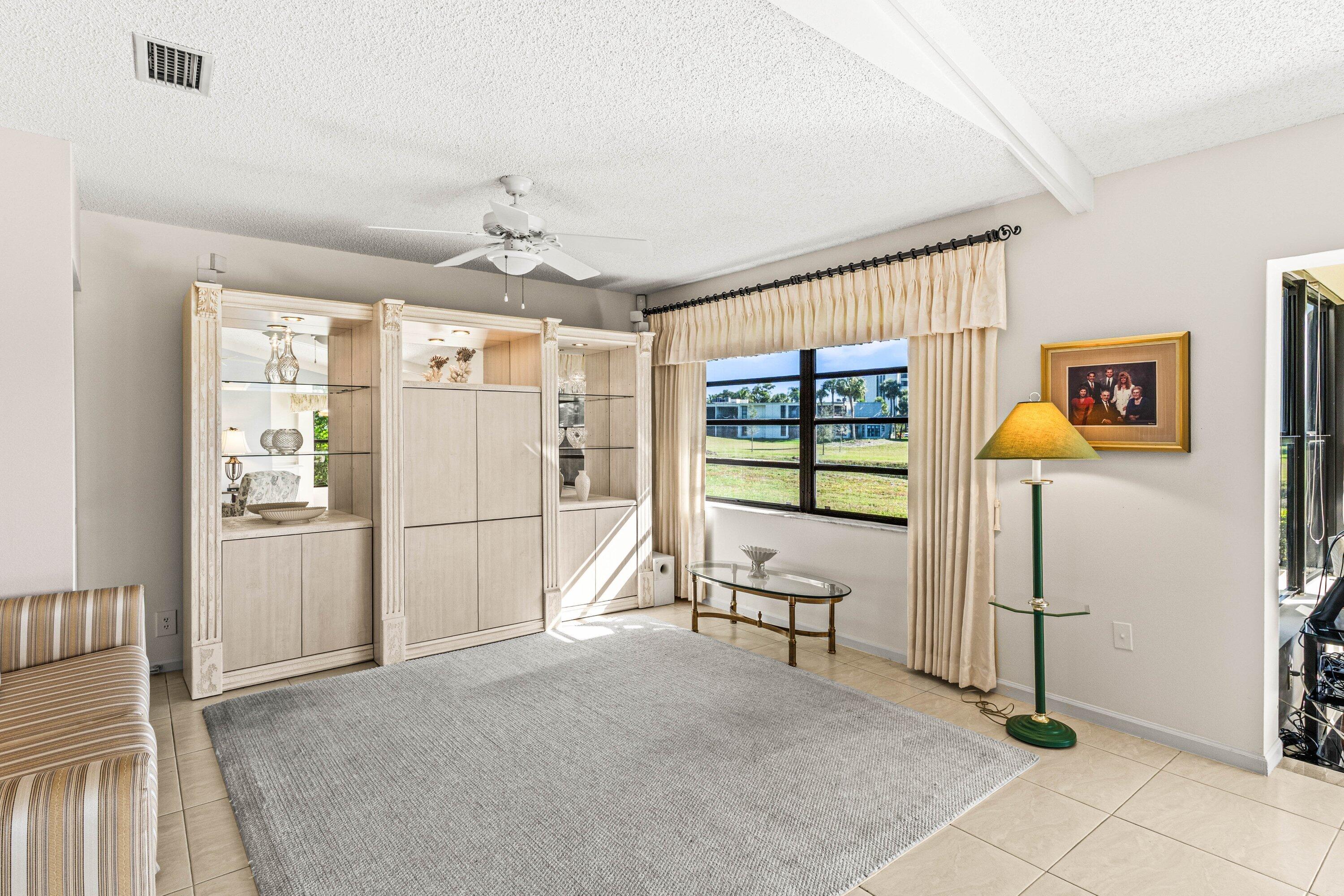 6426 Casabella Lane Boca Raton, FL 33433 - Photo 25 of 42 a view of livingroom with furniture wooden floor and window