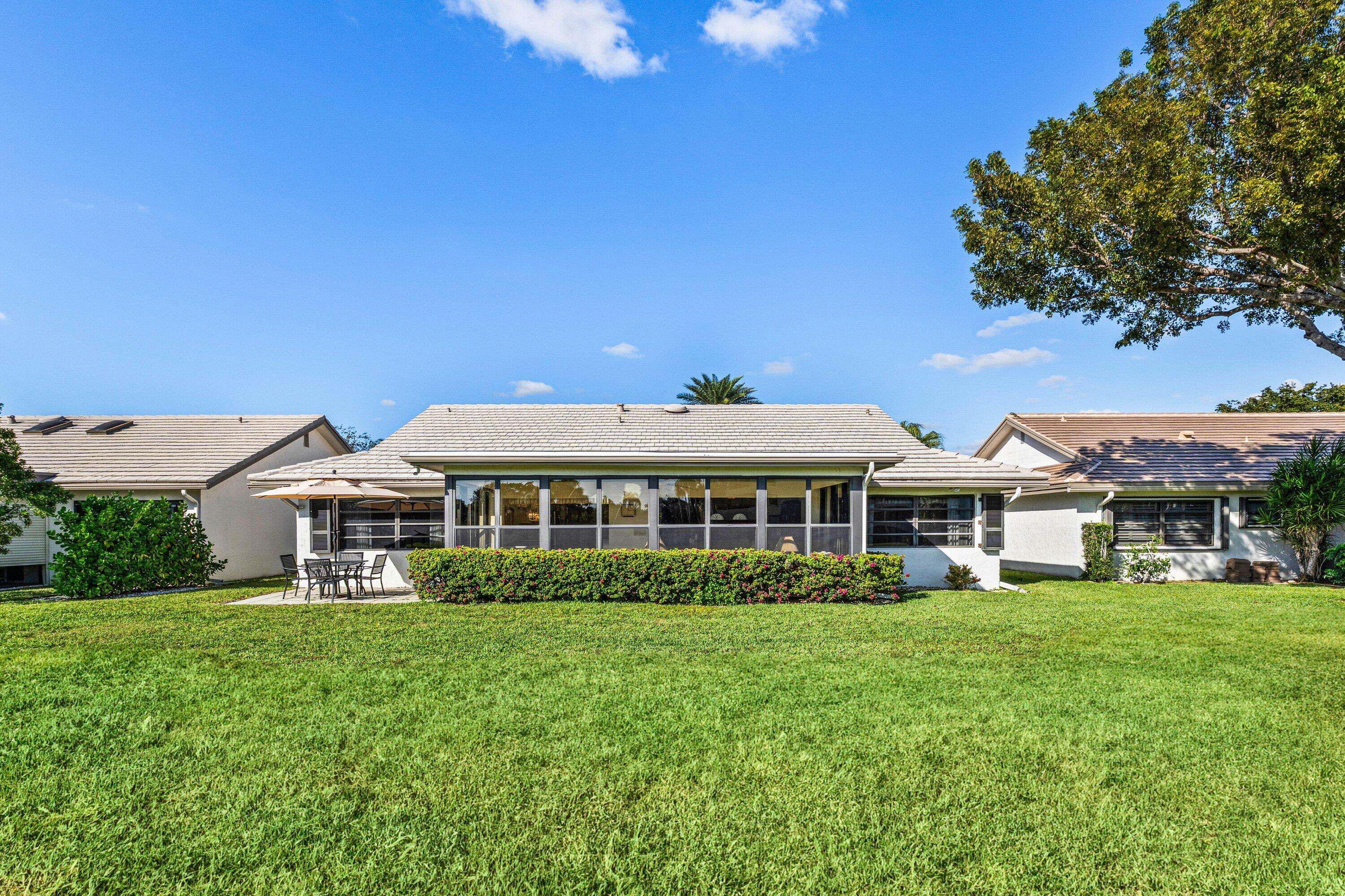 6426 Casabella Lane Boca Raton, FL 33433 - Photo 33 of 42 a front view of a building with garden