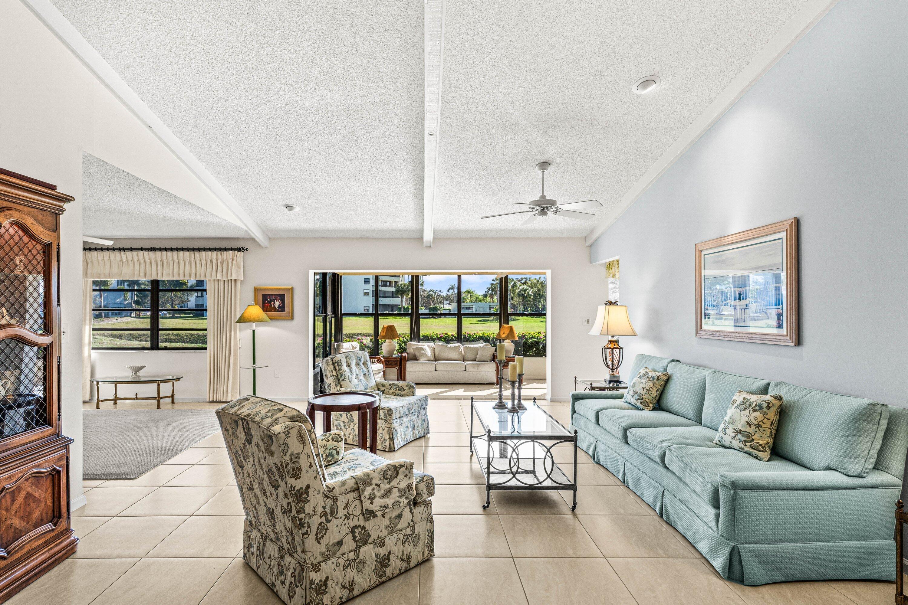 6426 Casabella Lane Boca Raton, FL 33433 - Photo 8 of 42 a living room with furniture and a large window