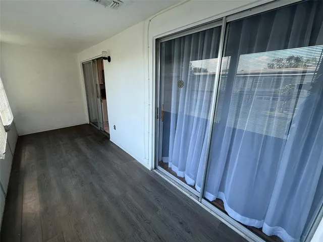 a view of an empty room and window