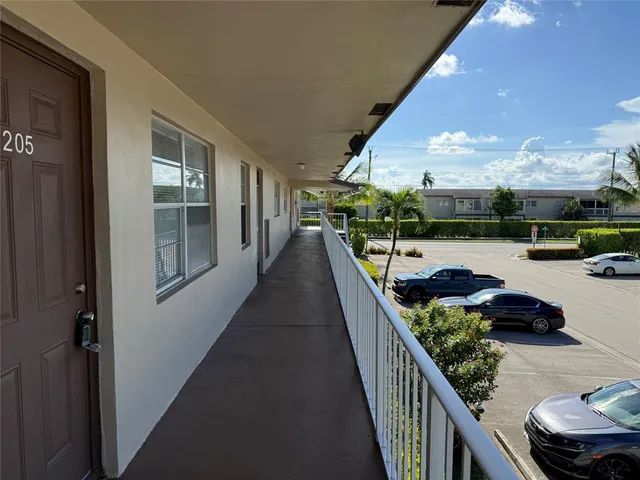 a room with furniture and a potted plant