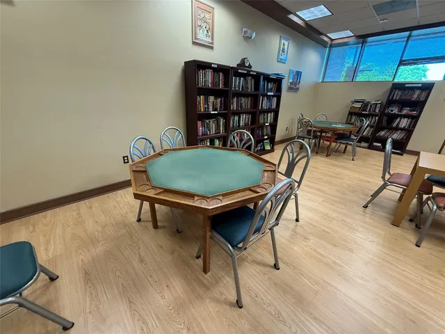 a room with gym equipment and a table